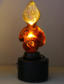 Amber lamp with iluminated base